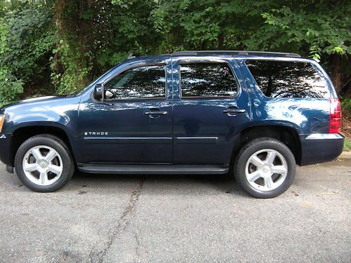 07 chevy lt rear captain seats 3 rows tow hitch v8 (very clean) 4x4