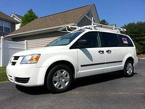 White cargo van with heavy duty adrian steel cargo management system