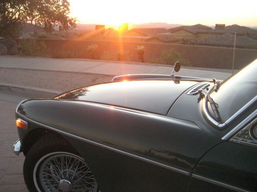 You must see this beautiful low mile, rust free british raceing green  gt.