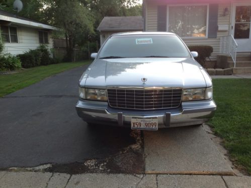 Sky blue cadillac in excellent condition leather seats face off cd player