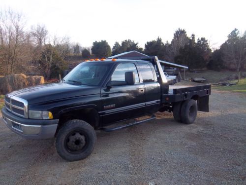 Dodge cummings 5sp 4x4 flat bed with rebuilt motor ready to work or play