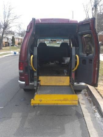 Ford passenger wagon with automatic lift