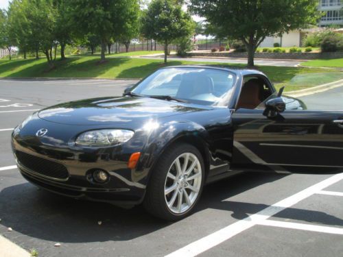 Brilliant black, excellent condition, low miles, suspension pkg, premium pkg,