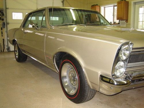 1965 gto capri gold w/parchment interior excellent condition