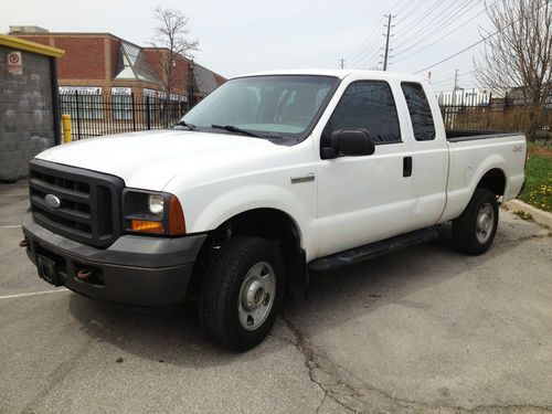 4x4 extended cab, 6 passenger, white on grey, ready for work