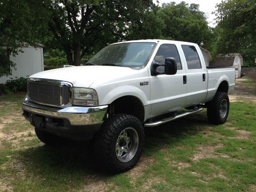 2002 ford f250 4x4 7.3l diesel crew cab truck with 6" lift kit, low miles!!!!
