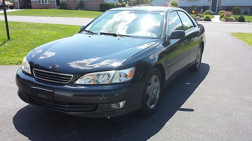 2001 lexus es300 black , tan leather loaded 68k miles rebuilt salvage title