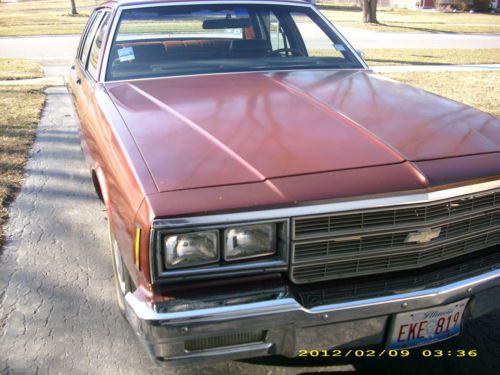 1982 maroon chevy impala sedan