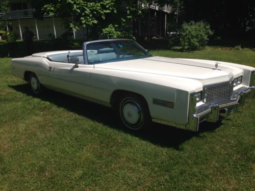 58k miles, single owner, cotillion white exterior, antique light blue interior