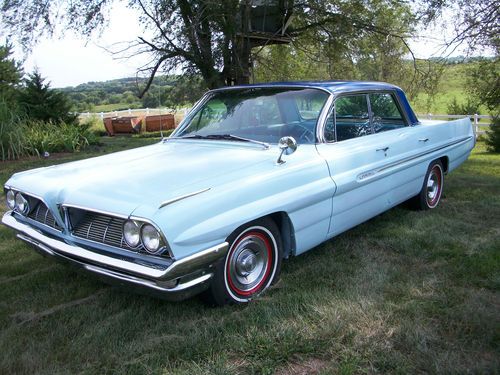 1961 pontiac catalina    a true hard top, bahama blue, and robin egg exterior.