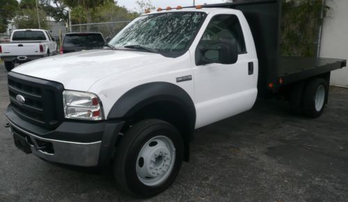 2006 ford  f-550 flat bed  cab + chassis 6.0 turbo diesel 12 ft bed. stake body
