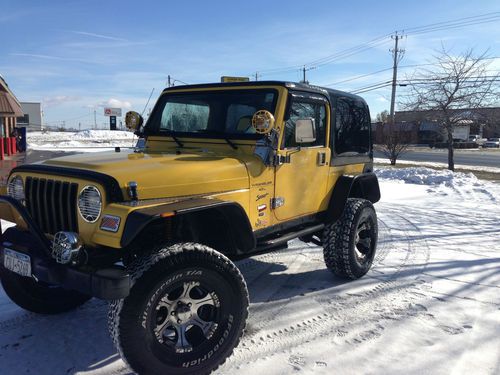 Jeep wrangler sport 2000 4 inch lift with 33 inch tires 119,800 miles very clean