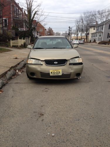 2001 nissan sentra gxe sedan 4-door 1.8l full disclosure. front end damage.