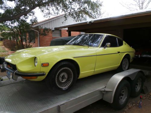 1971 datsun 240 z with factory air, 4 speed, and day glow paint.  texas car!!!