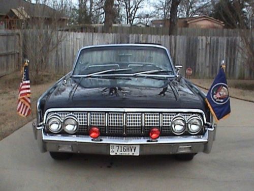 John f. kennedy assassination limousine look-alike with presidential flags