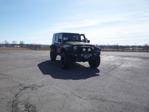 1 owner, 2008 jeep jk wrangler4 door, sahara package =dk green/ grey interior