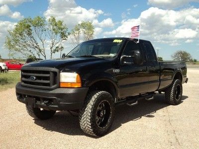 1999 ford f-250 lariat, ext. cab, 2wd, pro comp susp., 35" nitto trail grapplers