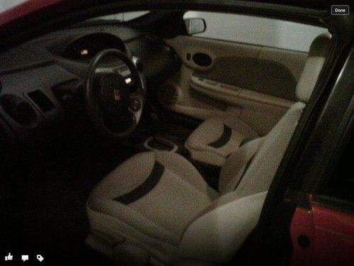 Red saturn ion coupe four doors