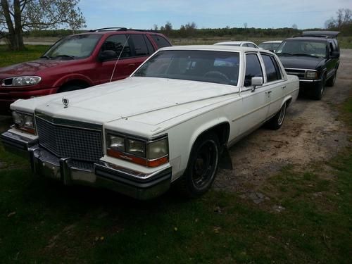 1987  cadillac  fleetwood brougham-  white