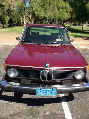 1975 2002  burgundy bmw  with tan interior.