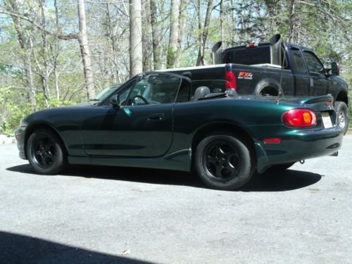 Miata mx5 ,green, a/c , power windows ..runs very good