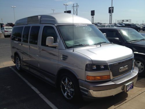 Handicap equipped gmc savana 1500 high top conversion with side lift.