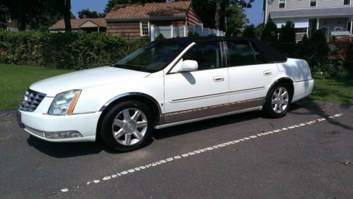 Low mileage cadillac deluxe touring sedan with trim upgrades