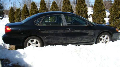 ~black ford tarus se 2000~ incl. radio/cd/mp3 player w/ ipod + iphone charger