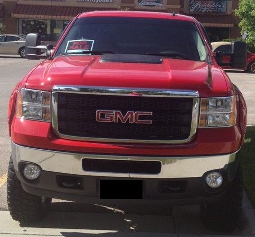 2011 red gmc 2500hd 6.6 duramax in excellent condition