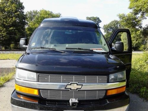 Black chevy se high top conversion van, explorer package