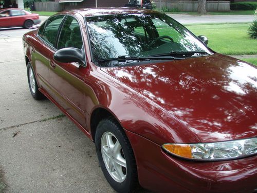 2003 burgundy, oldsmobile alero gl 4 door, 6 cl, 115,700 miles.