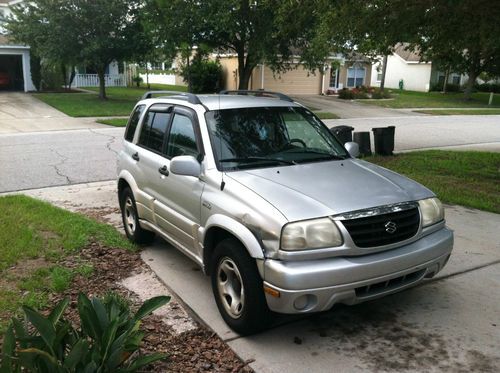 Grand vitara jls, silver with black, runs fine, great for parts!