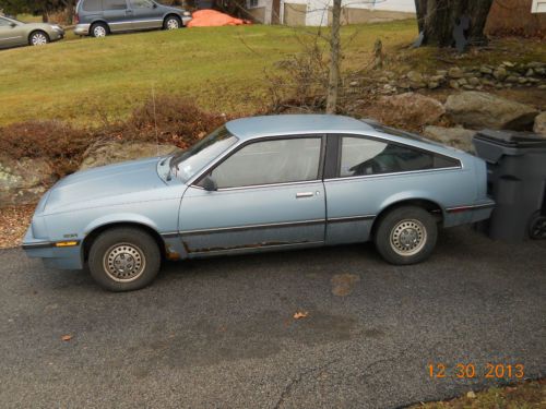 1986 chevy cavalier coupe.  hatchback style. blue, body in fair condition.