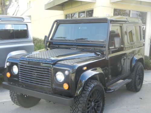 1997 land rover defender 90 autosport black series upgraded interior and wheels.