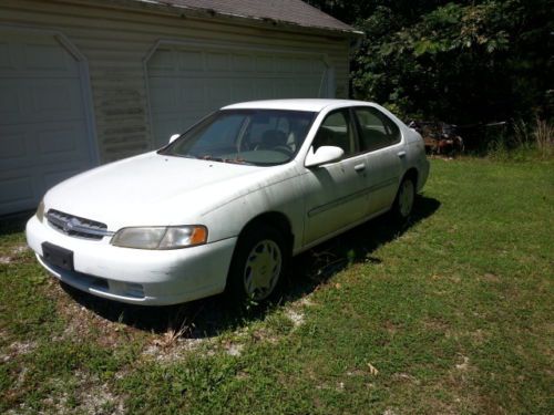 1998 white 2.4l automatic 4door altima with tan interior.