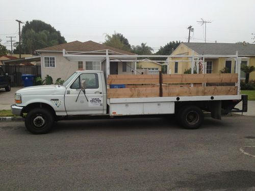Stake bed truck with lift gate and steel deck
