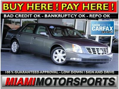 We finance '06 cadillac luxury sedan leather wood trim alloy wheels