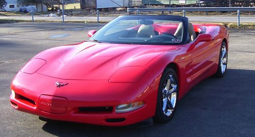 1999 corvette convertible..58,342 pampered miles..red with tan top,tan interior