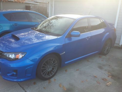 2011 rally blue wrx premium 4d with bonus winter wheel set.