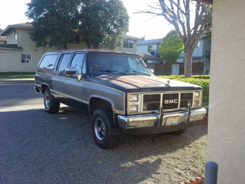 1988 gmc suburban,  sierra classic,  4 wheel drive, black and silver