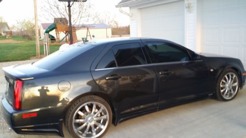 2005 cadillac sts 92,000 miles. 20 inch chrome rims! very sharp car!