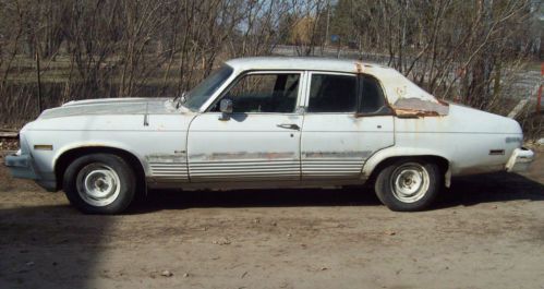 1974 chevrolet nova 4 door 350 cubic inch 4 barrel carb with headers