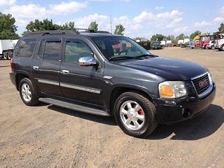 2003 envoy slt .sport utility 4x4 7 passenger. black .tv power windows and seats