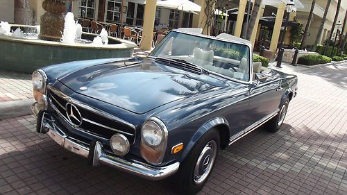 1970 mercedes 280 sl. blue metallic with original mb white interior. superb car!