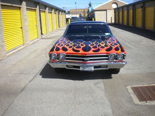 Custom black paint with flames ,shaved door handles lowered.number matching ss