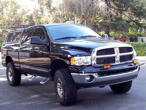 2004 dodge 325cummins diesel4x4_35"toyo_leer_yakima_bedrug_banks_kore lift_1ownr