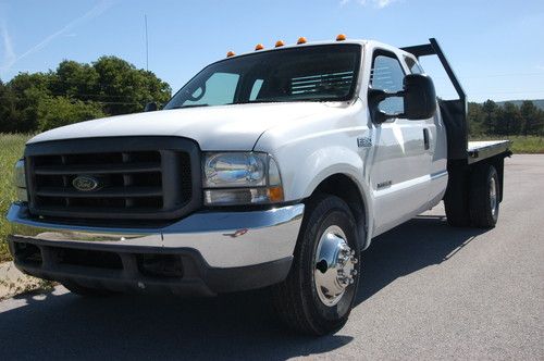 2000 ford f350 super duty diesel extended cab and chassis w/ new 9.5 flat bed