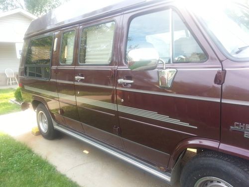 Professionally modified extended roof van w/wheelchair lift and hand brakes