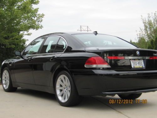 2003 bmw 745 black/black  0utstanding condition plus set of mounted winter tires