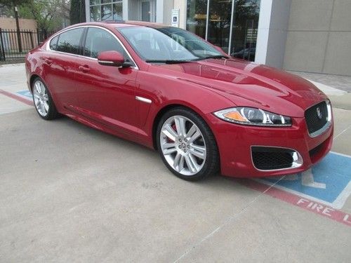 Clean, jaguar marketing program car, red brake calipers. italian racing red